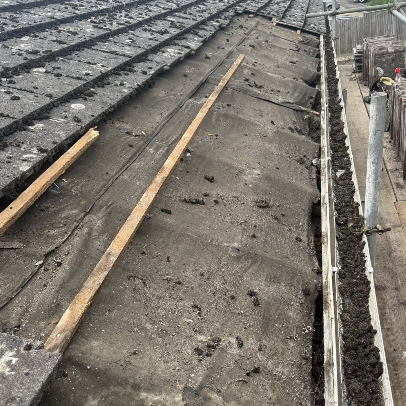 A roof with the tiles off during a roof repair job